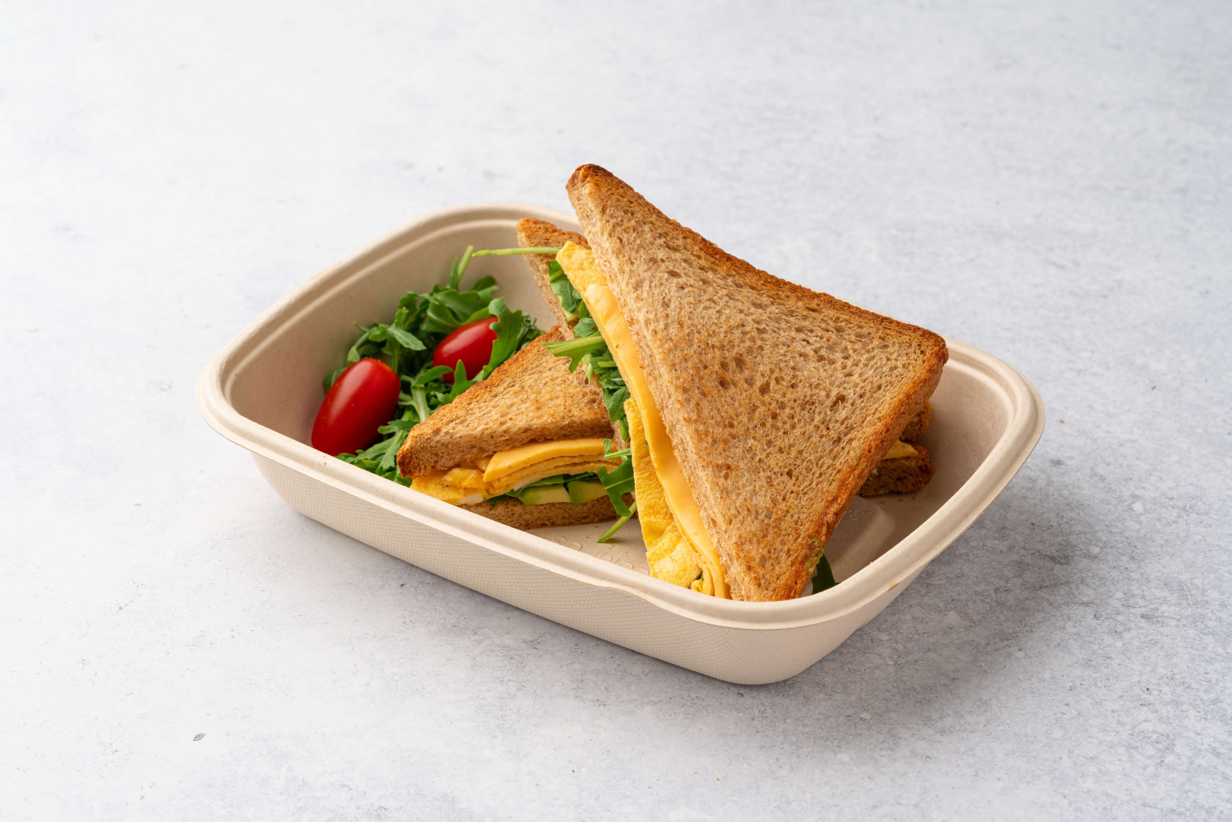 Egg Sandwich With Cheese Avocado and Arugula